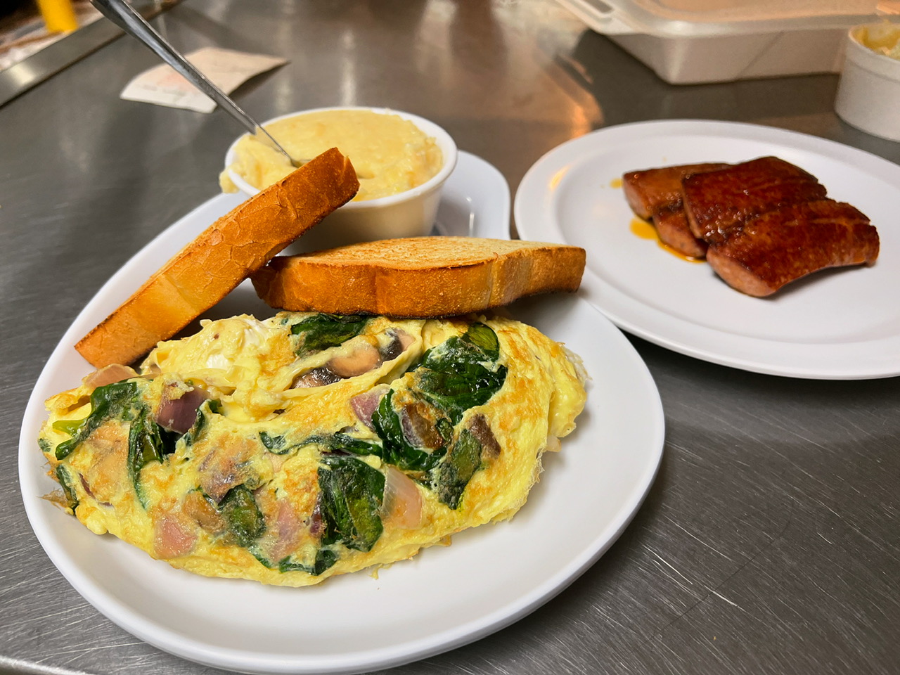 Omelet plate with hash browns and bacon